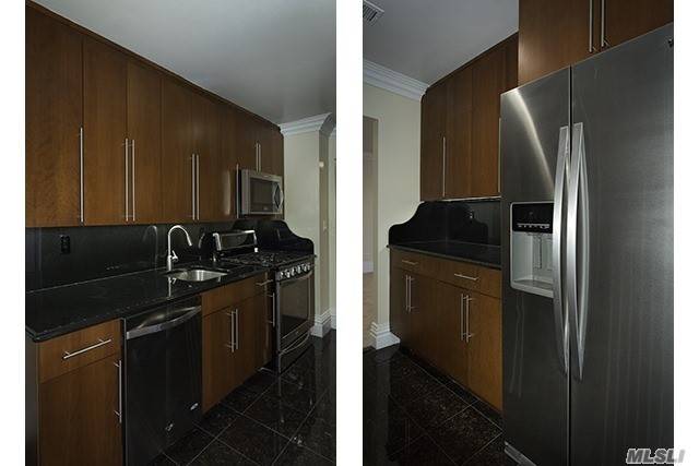 Tuscany Kitchen Cabinetry W/ Granite Countertops & Backsplash, Stainless Steel Appliances, Granite Kitchen Flooring.