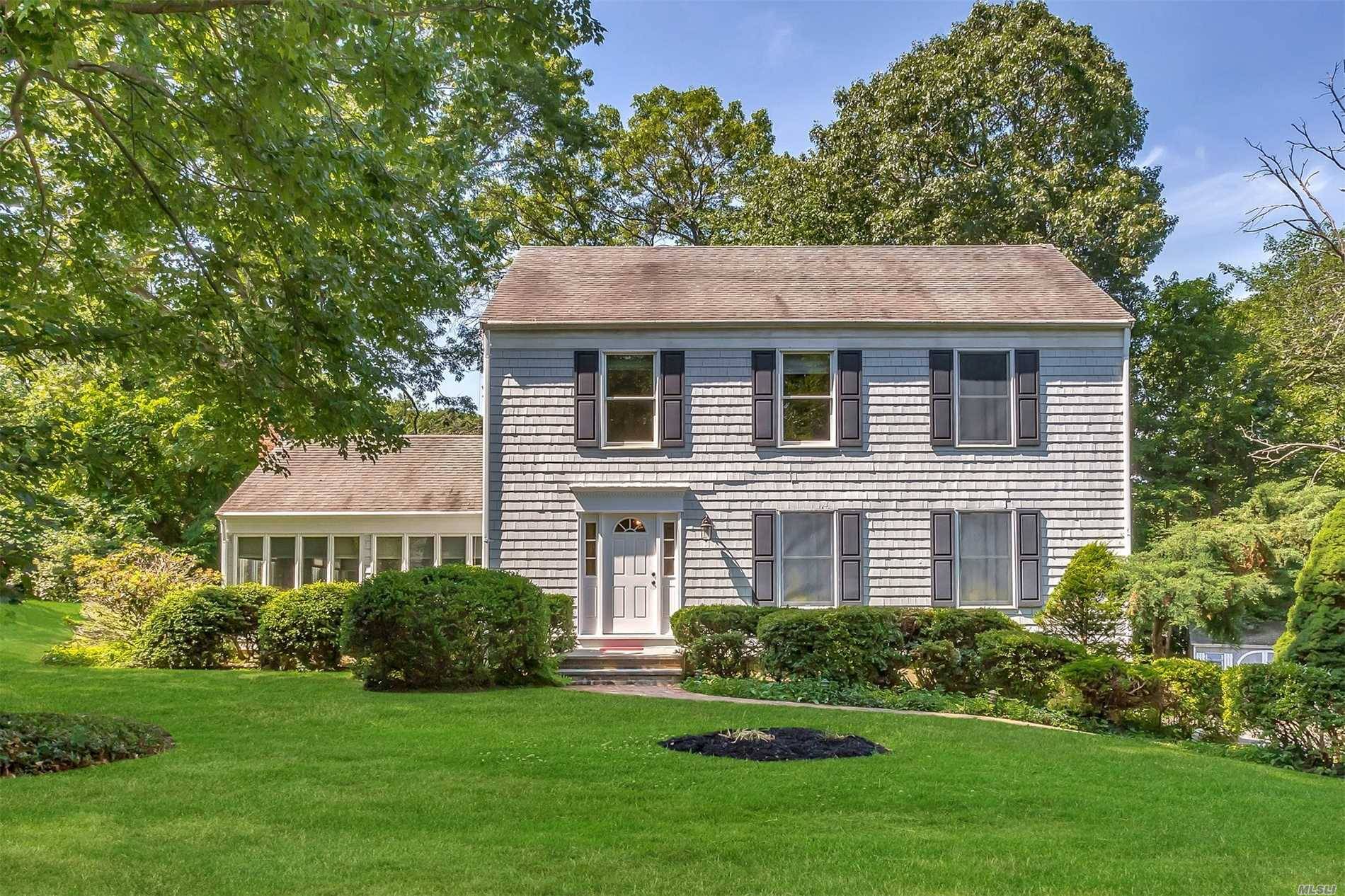 New England Style Colonial Located In The Charming Enclave Of 