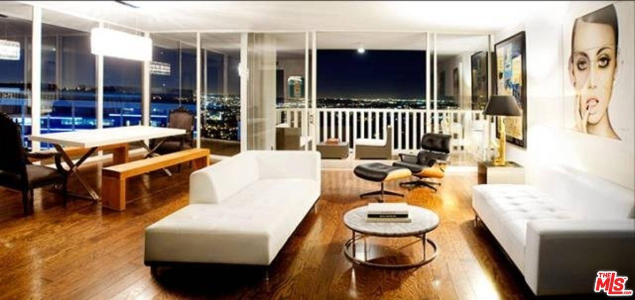 Watch the City sparkle at night from this coveted South East corner unit on the 16th Floor of the Sierra Towers - LA's most prestigious address