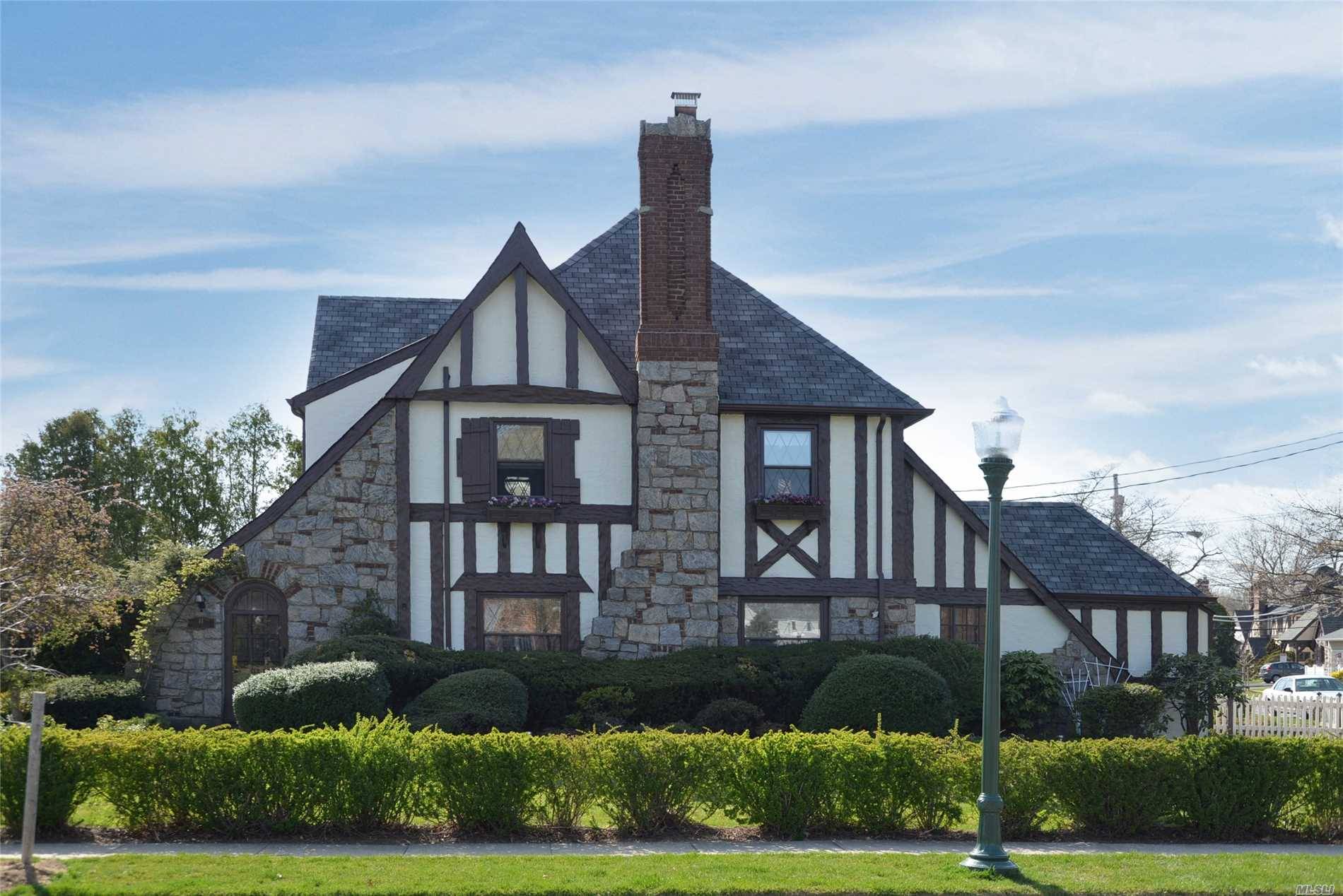 Bright And Sunny Traditional Tudor Boasts Expansive Rooms With Rich Mouldings, Stain Glass Windows, High Ceilings And Hard Wood Floors.