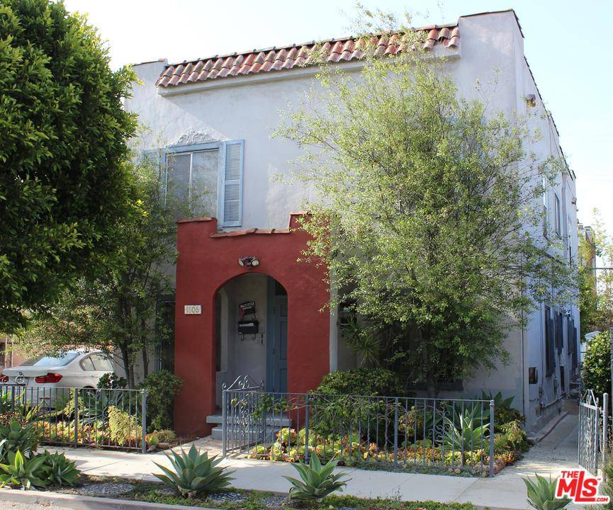 Spanish style 1924 two-story fourplex with permitted studio