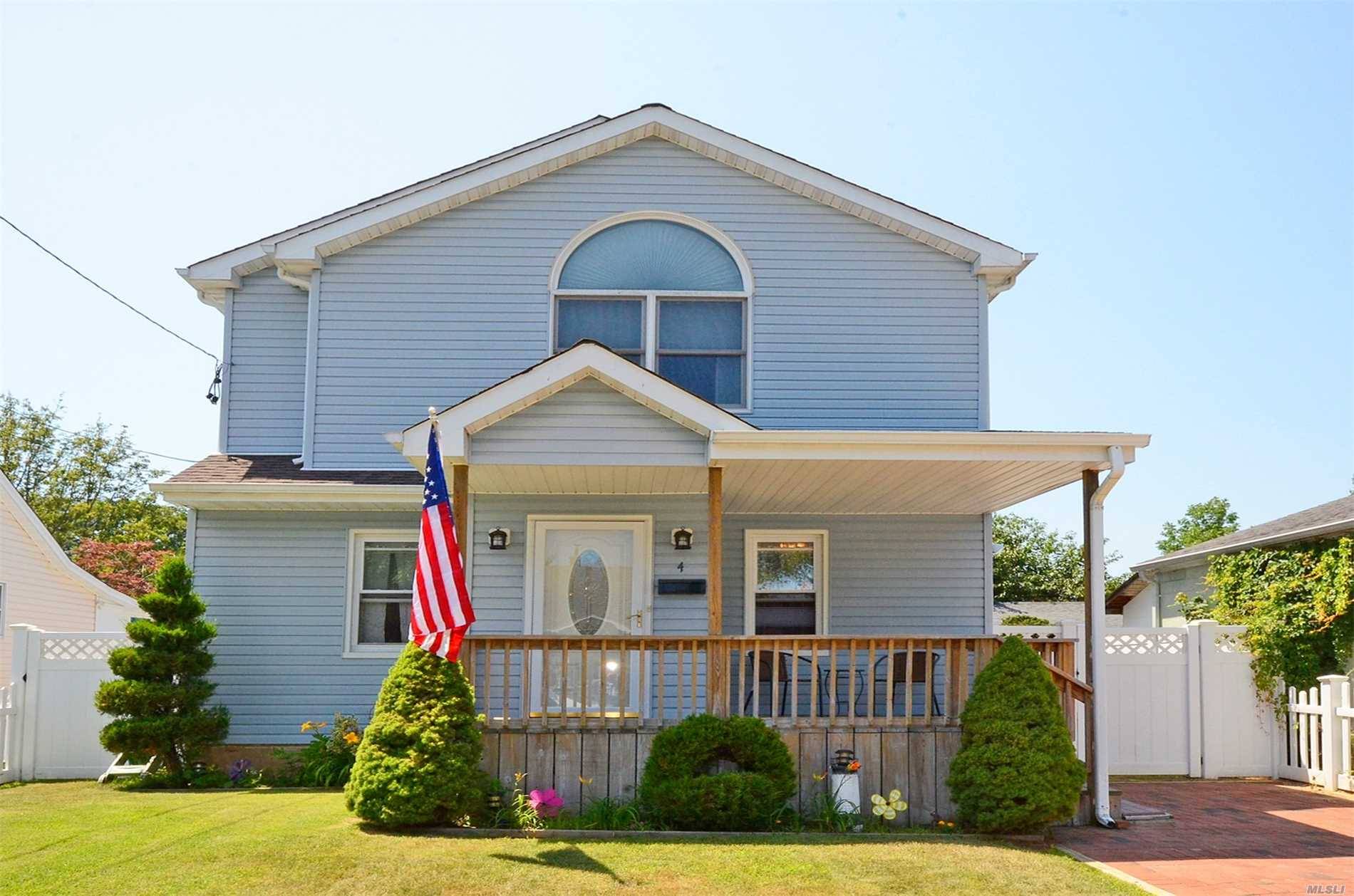 Enter Into Your Captivating Expanded Cape Style Home In The Heart Of Bellmore..