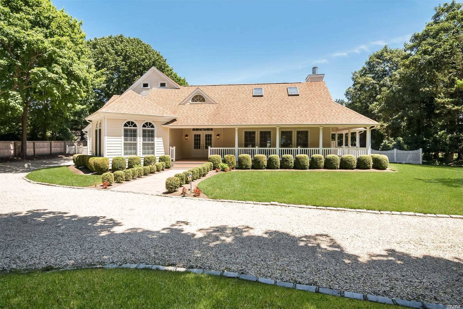 This Meticulous Home Is Set On Just Shy An Acre South Of The Highway In Quiogue.