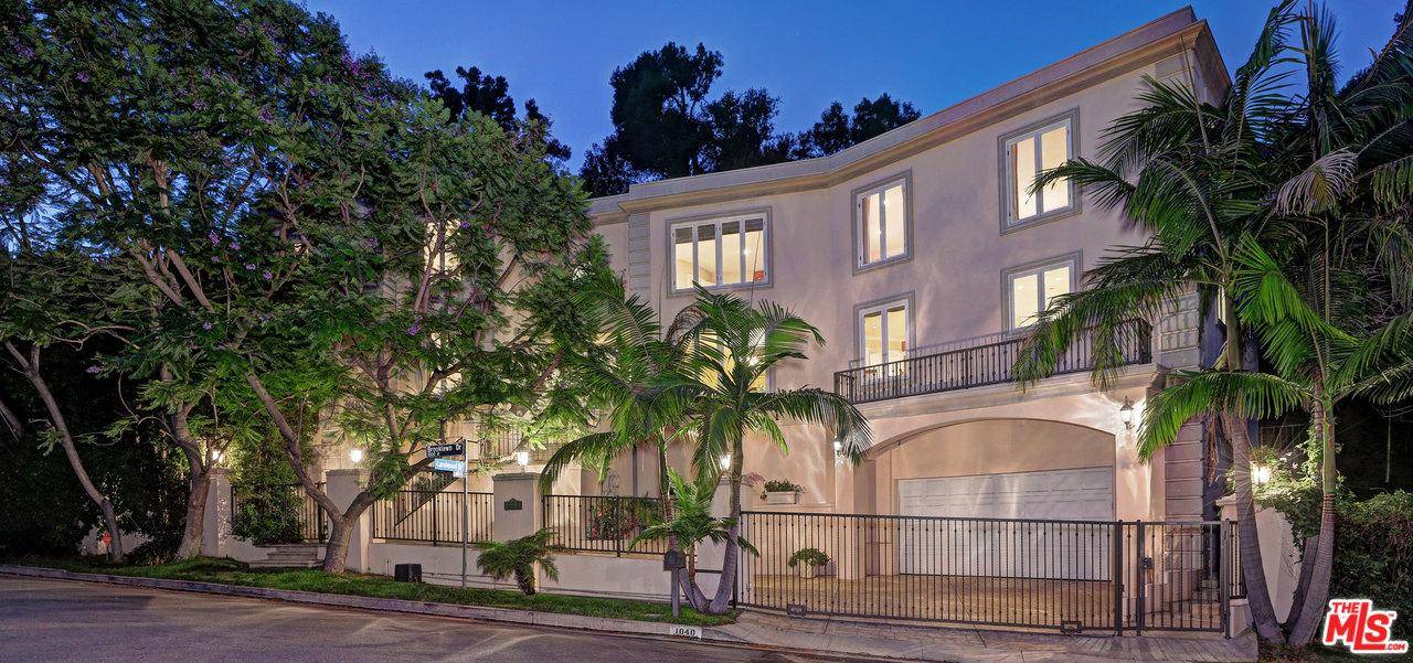 WITH NEARLY 145 FT OF FRONTAGE ON A MOST COVETED HOLMBY HILLS ROAD