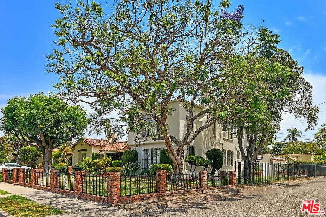 Pride of ownership duplex on prime tree-lined Crestview street
