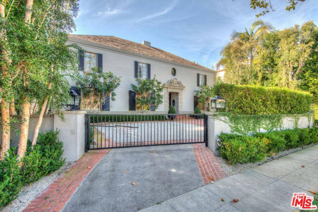A chic French contemporary home perfectly situated on one of Beverly Hills most beautiful streets