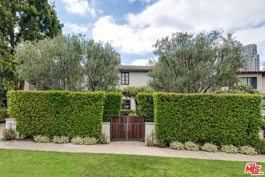 Situated behind beautifully manicured hedging this gorgeous turn-key Spanish/Contemporary is the Little Holmby gem that you have been searching for