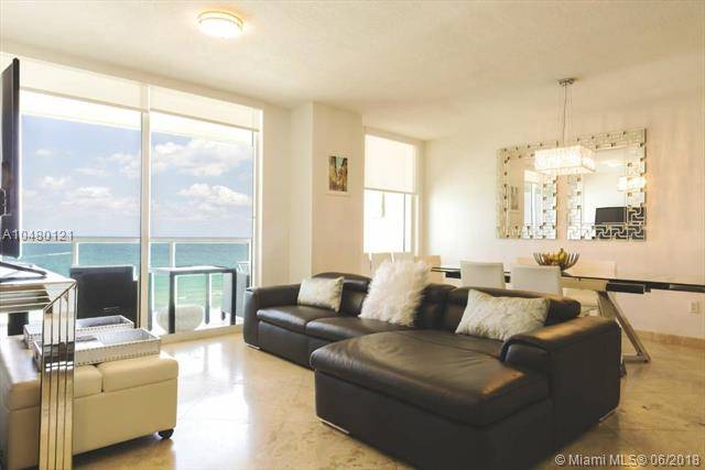Spectacular unit with breathtaking direct ocean views from every room with elegant living room