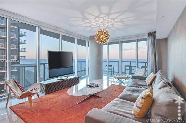 Enjoy living in this Astonishing corner residence w/ floor to ceiling windows offering magnificent views of ocean