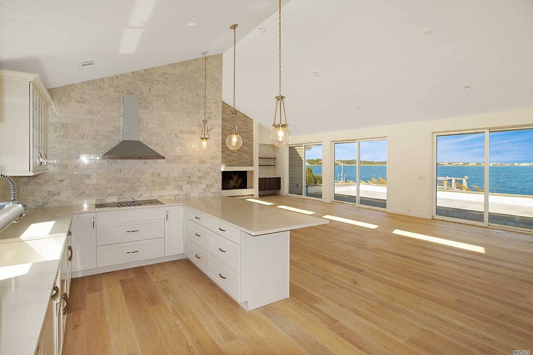Endless open bay views from the moment you enter this completely renovated Contemporary.