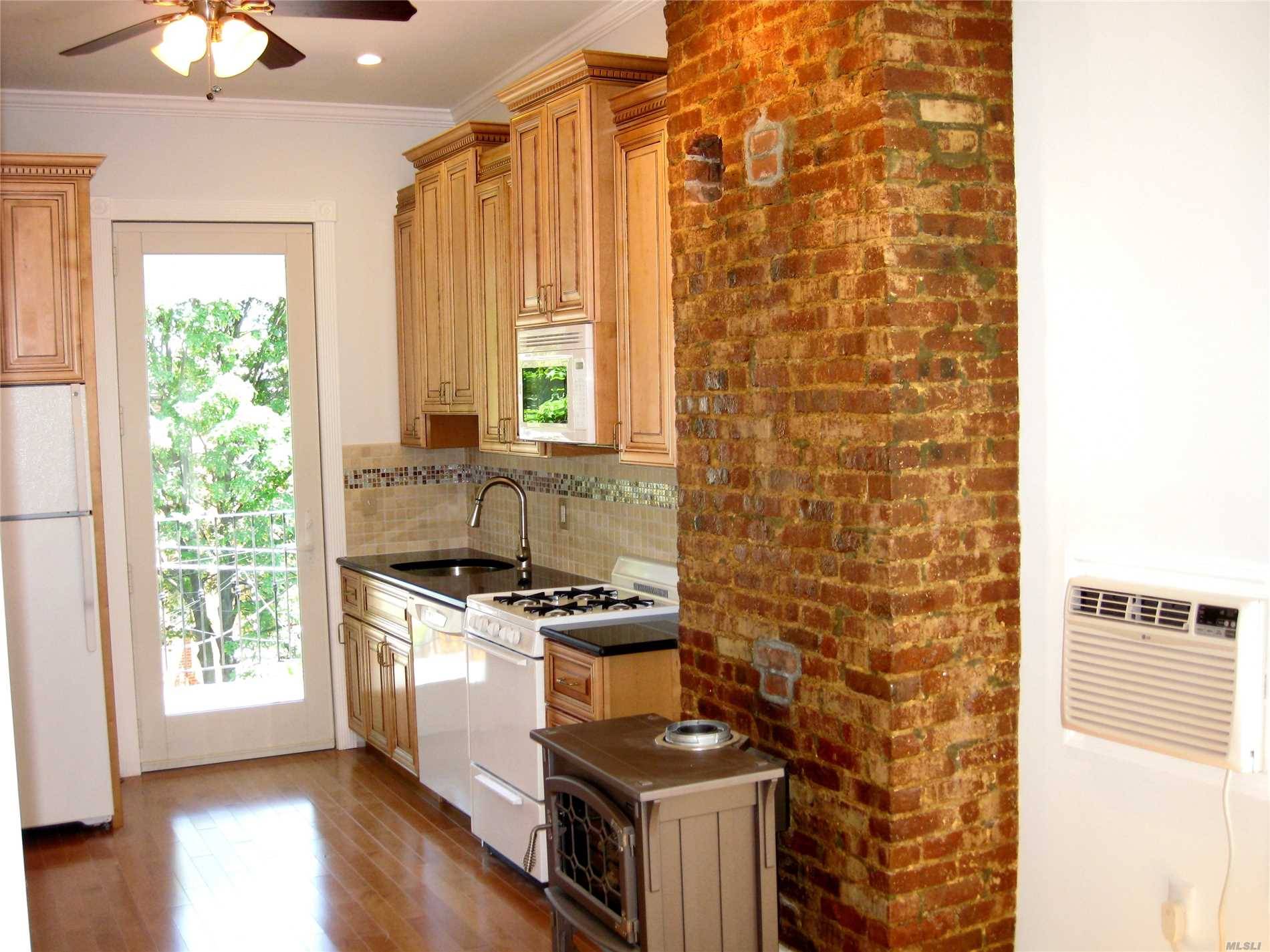 Updated 2 Bedroom Two Bath Apartment With Laundry And Terrace With Back Yard Access.