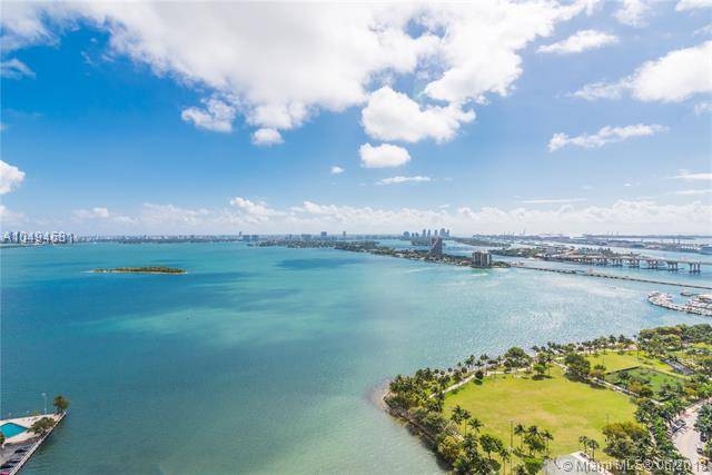UNIQUE FLOW-THRU FURNISHED PROFESSIONALY DECORATED UNIT CONVERTED INTO A 2 BEDS WITH UNDIVIDED VIEWS OF BISCAYNE BAY