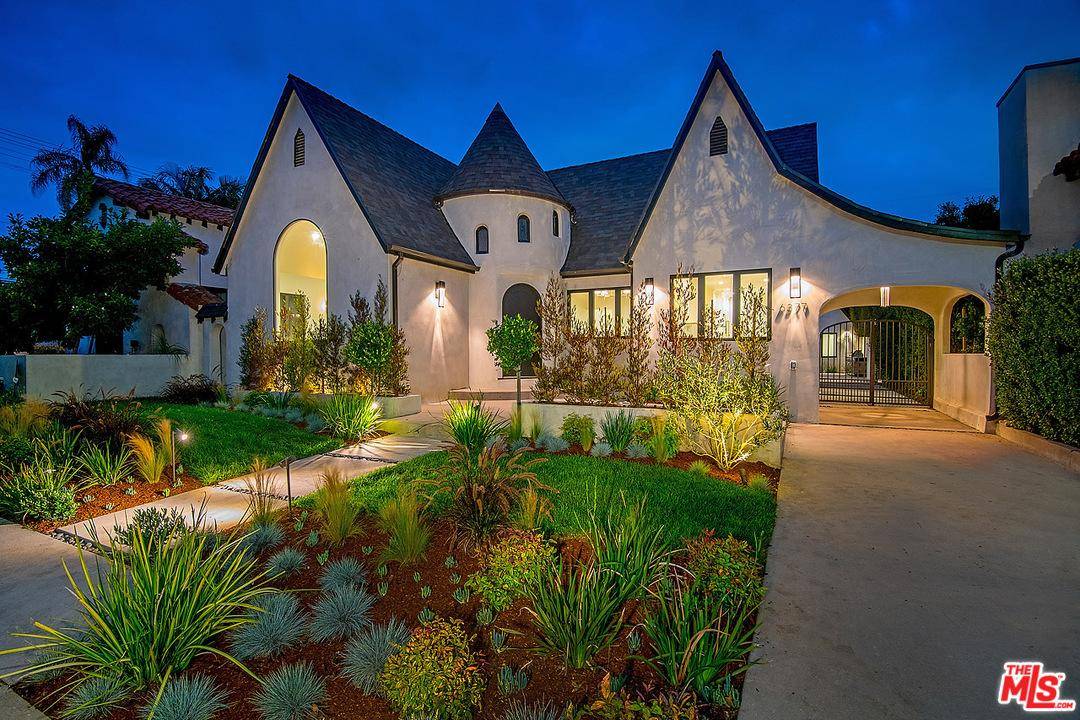 Enchanting storybook Tudor in prime Beverly Grove offers unparalleled craftsmanship and exceptional amenities
