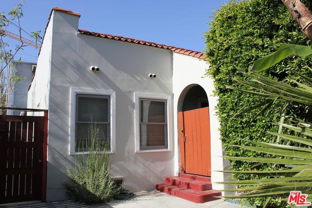 Charming 1930's Spanish front house with fireplace in LR and private front patio - no off street parking