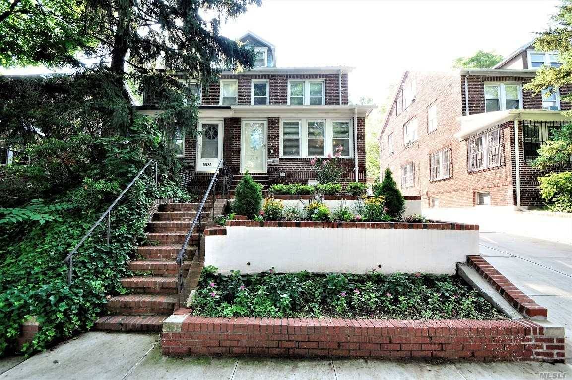 Lovely Excellent Condition Brick Semi Detached Townhouse Located Near Forest Hills Gardens On Tree Lined Ascan Avenue.