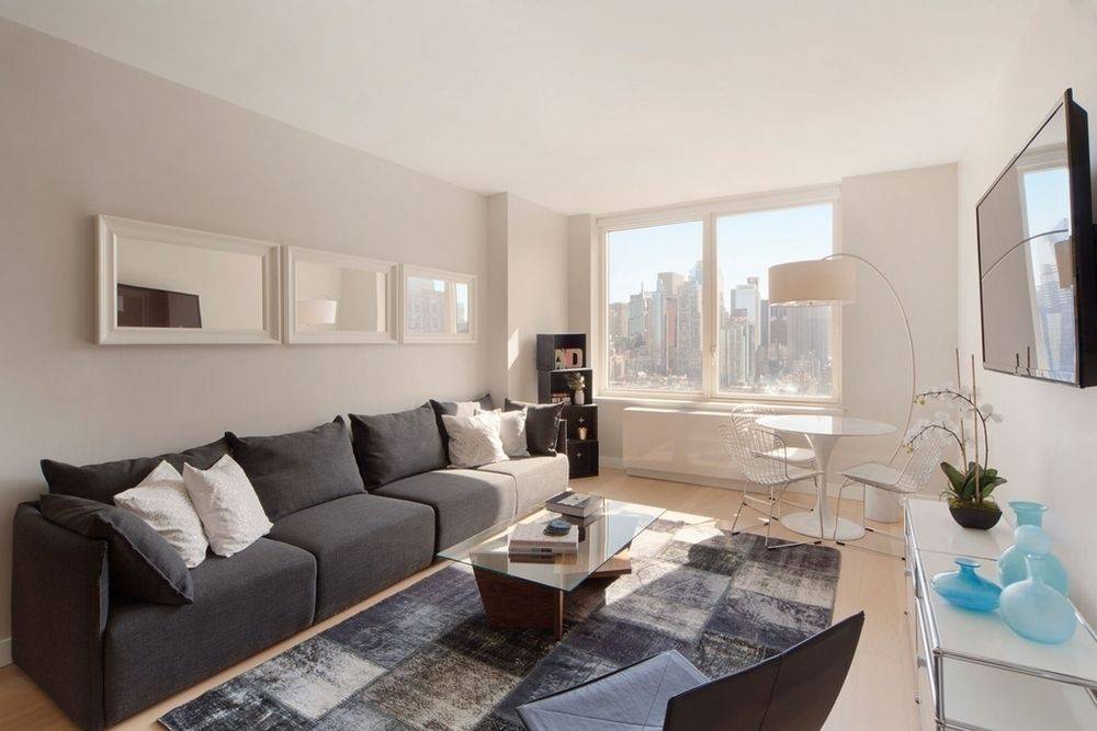 No Fee! Sprawling corner one bedroom with extraordinary city views! Available 7/22. Located in Midtown West!
