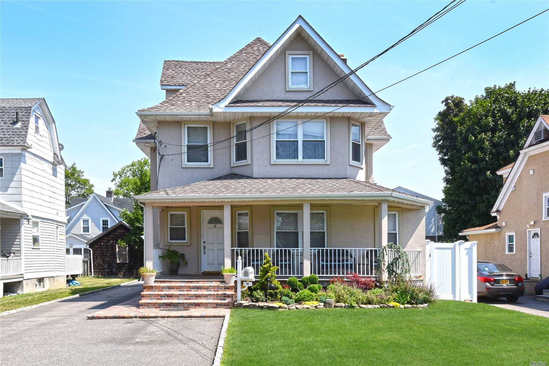 Move Right Into This Recently Renovated Colonial In Old Woodmere.