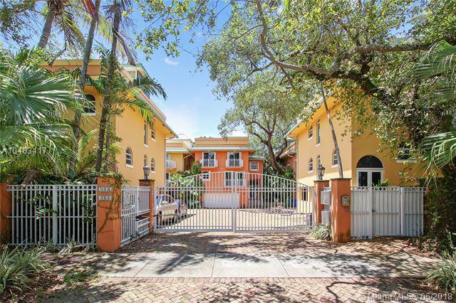 ENJOY THE COCONUT GROVE LIFESTYLE FROM THIS SOUGHT-AFTER GATED COMMUNITY OF 9 TRI-LEVEL TOWNHOMES IN THE HEART OF COCONUT GROVE
