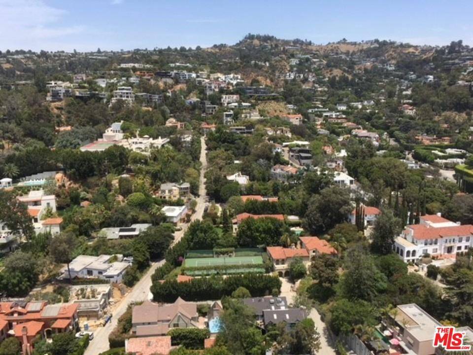 Bright and open 27th Floor condo with walls of glass overlooking the picturesque Hollywood Hills