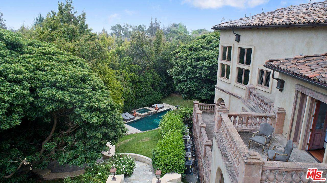 Concealed behind private gates on one of the most exclusive streets of Holmby Hills