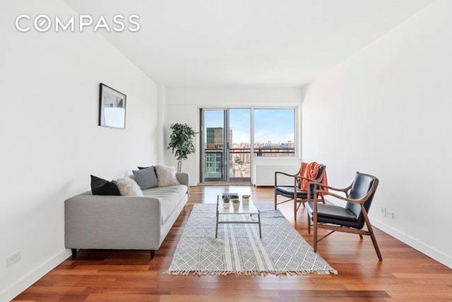 Take in breathtaking sunrises in this gorgeous high floor one bedroom home featuring beautiful updates, private outdoor space and great storage in an amenity rich Greenwich Village building.