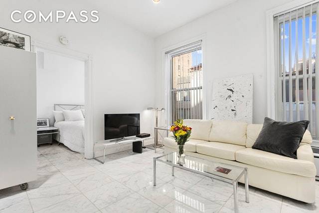 Rarely available this incredible bright 1 bedroom home is located in a 25 foot wide 1910 Grand Limestone Mansion between Madison and Park.