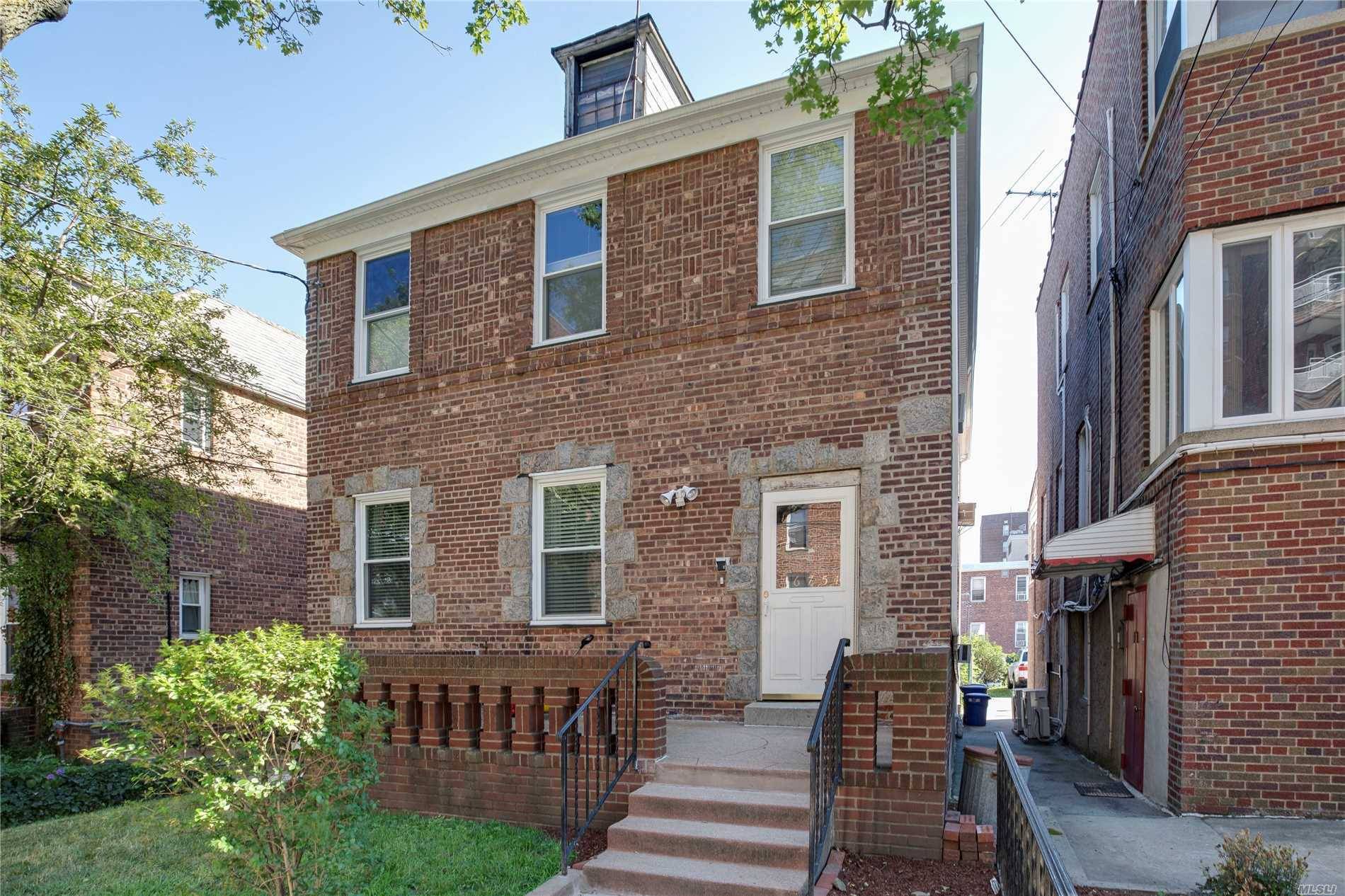 Detached Brick 2 Family House With 2 Car Garage On A Residential Tree Lined Street.