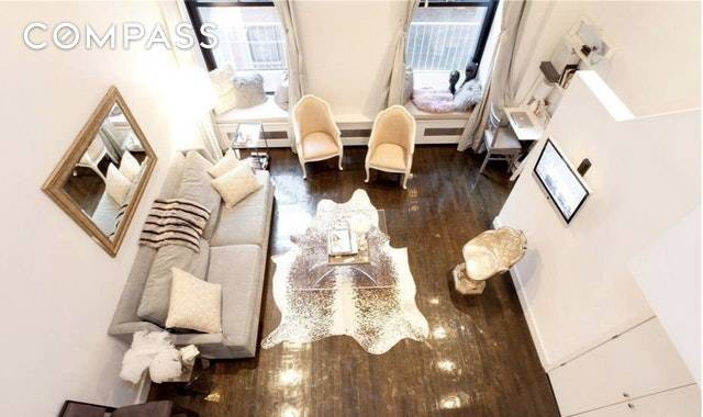 Come home to own elegantly designed loft with soaring 15' ceilings located in one of downtown Manhattan's most sought after neighborhoods.