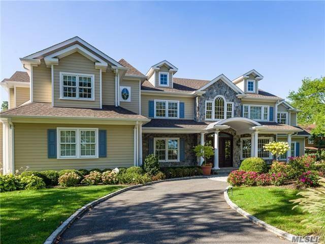 Majestic 8 Year Old Transitional Colonial With 18' Ceilings And An Open Floor Plan.