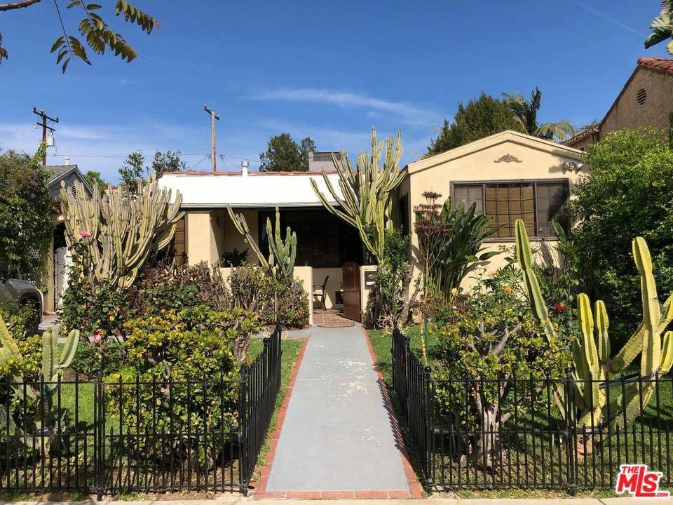Restored Spanish Style Bungalow located in the heart of WeHo with a large front and backyard