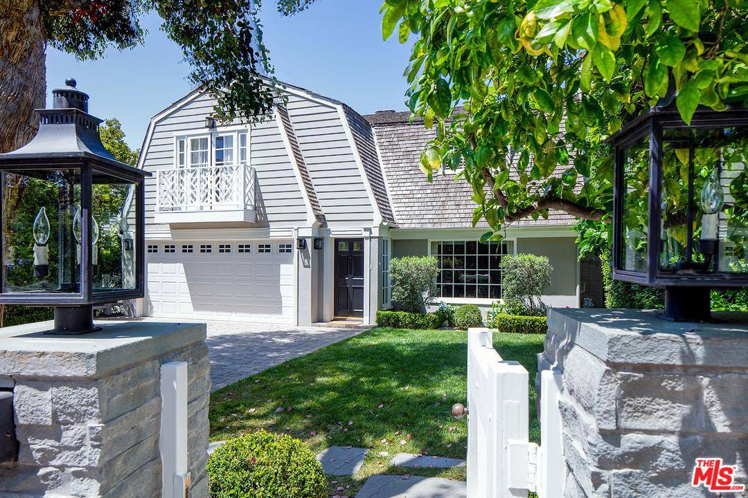 Much admired 1930's two story Colonial situated midway between San Vicente and Sunset on the desirable west side of beautiful