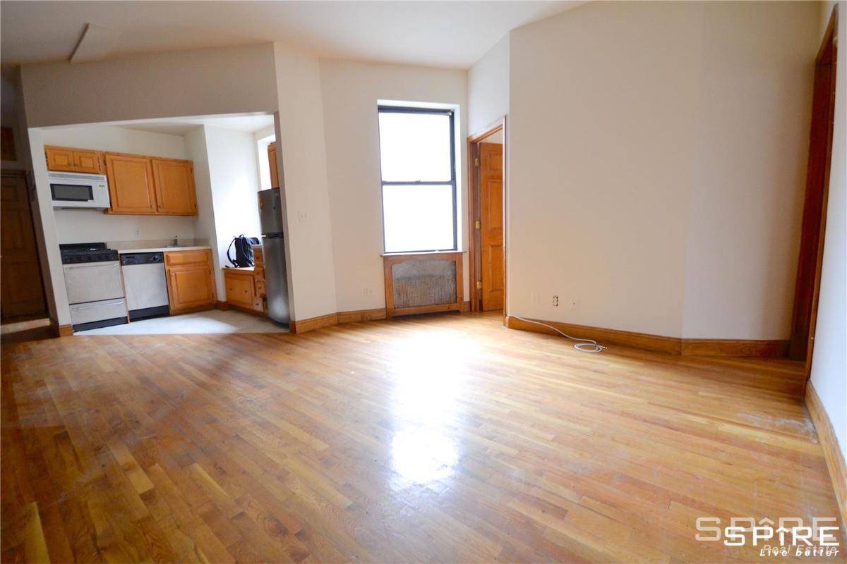 The apartment has a large and spacious living room with a beautiful exposed brick wall and soaring high ceilingsStunningly renovated, windowed open kitchen with SS appliances, granite counter tops and ...