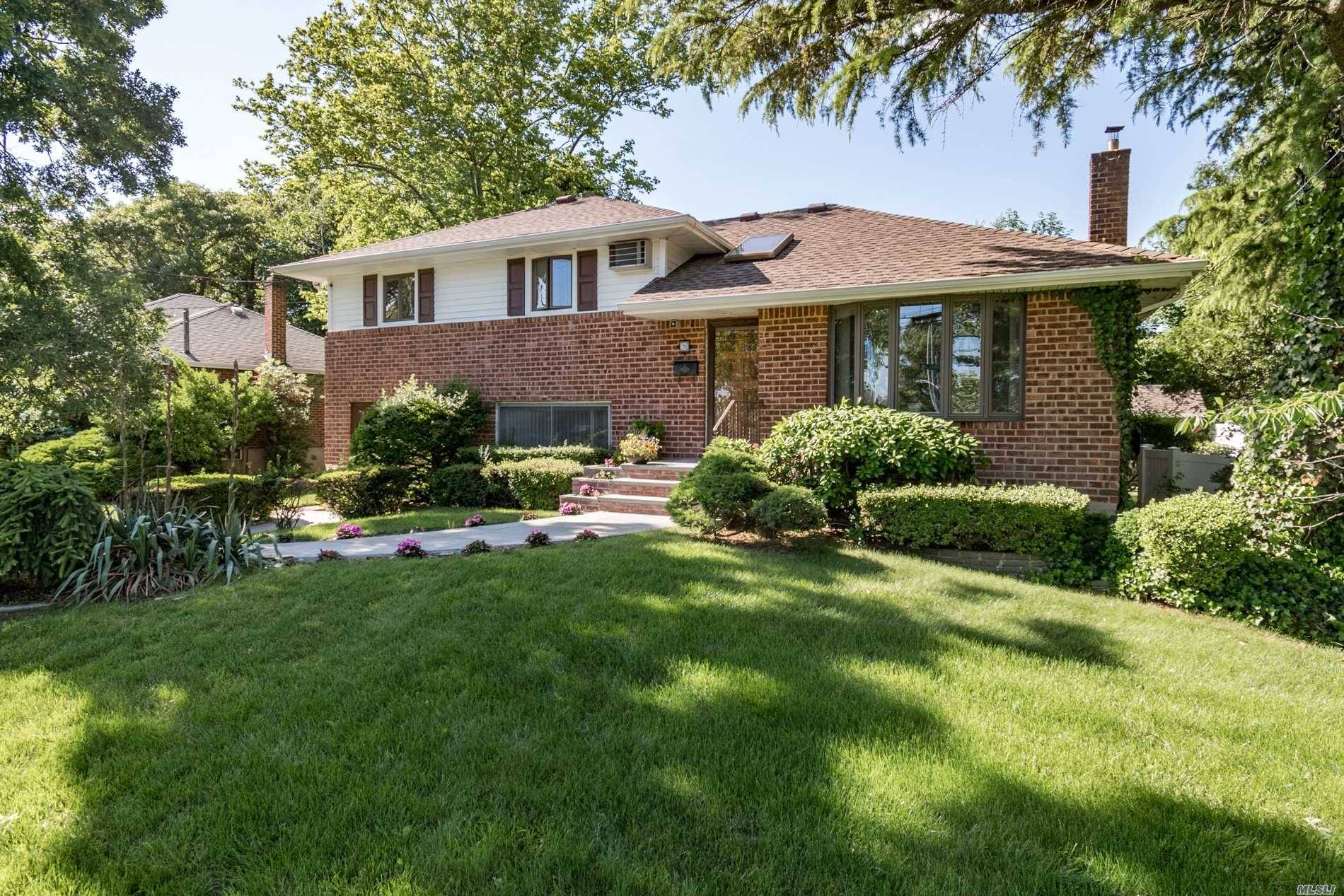 This Spacious 4 Level Brick Split With Great Curb Appeal.