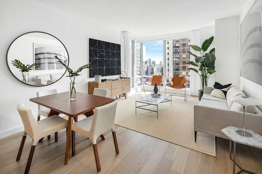 1 Month Free and No Fee! Spacious CORNER 1 BEDROOM apartment features luxurious interiors including floor-to-ceiling windows exposing sunlight and views of Manhattan! Pool, Garage, Roof Deck And More!