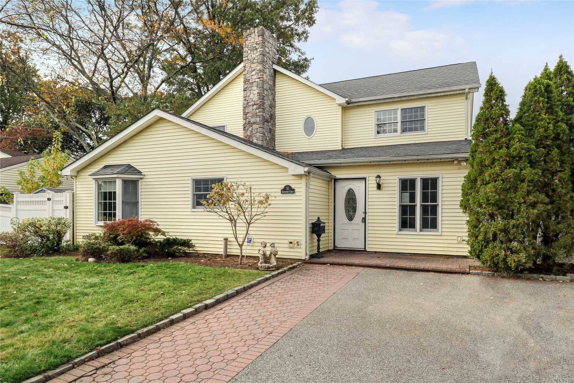 Colonial Updated With Six Bedrooms, Three Baths, And Two Family Rooms.