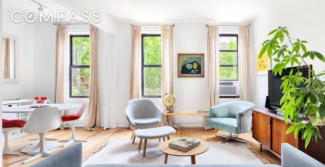 Soft warm light covers every square inch of this large and charming pre war corner apartment in the center of Windsor Terrace.