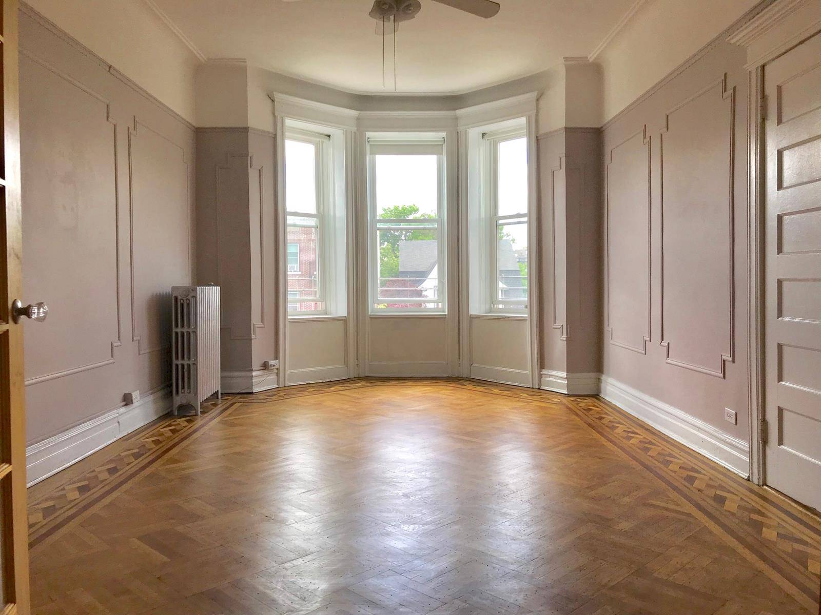 Spacious four room third floor apartment in private three family home.