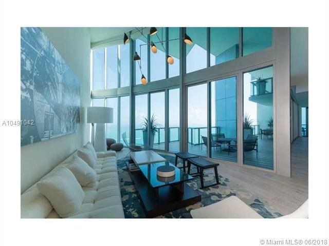 Private elevator leads you to a unique high-end completely remodeled two-level Beachfront 4BR + maids quarters/5