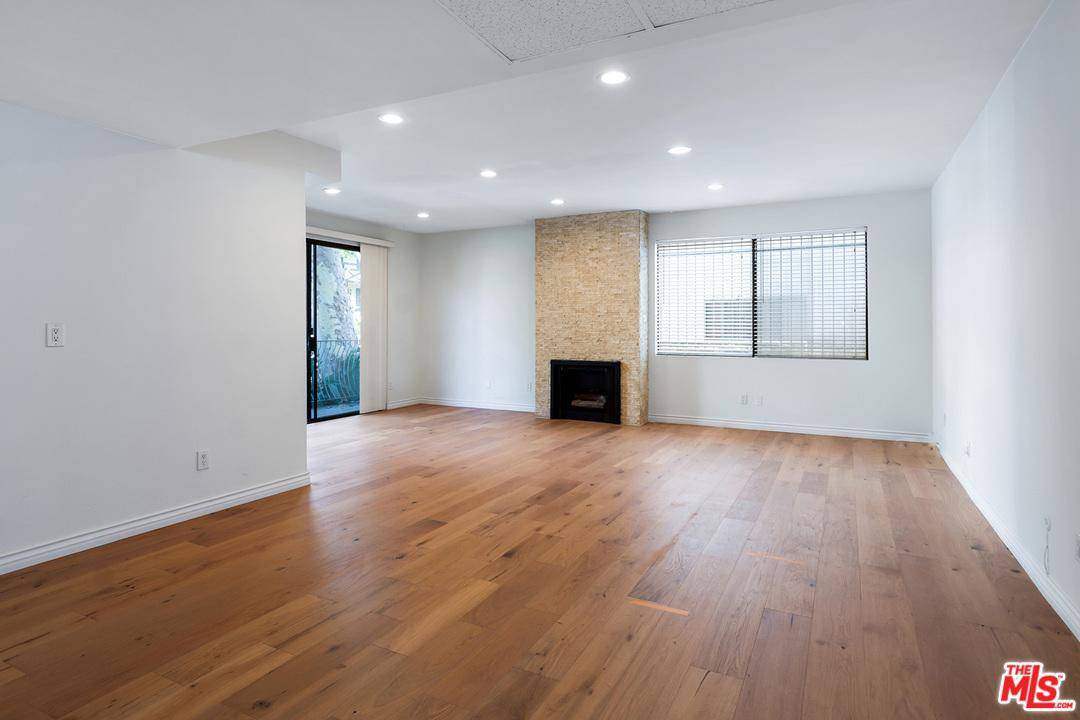This gorgeous and spacious first floor condo is perfectly situated in Beverly Hills