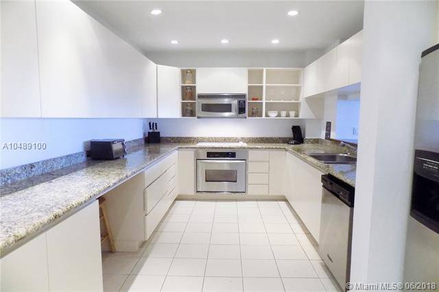 This open unit is designed to perfection with contemporary kitchen featuring granite countertops