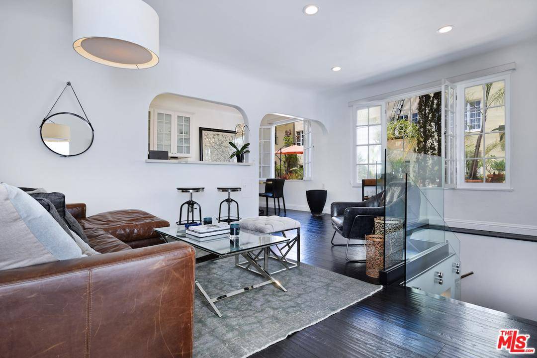 This elegant townhome is complete with designer finishes located at the desirable Hayworth Gardens building in West Hollywood