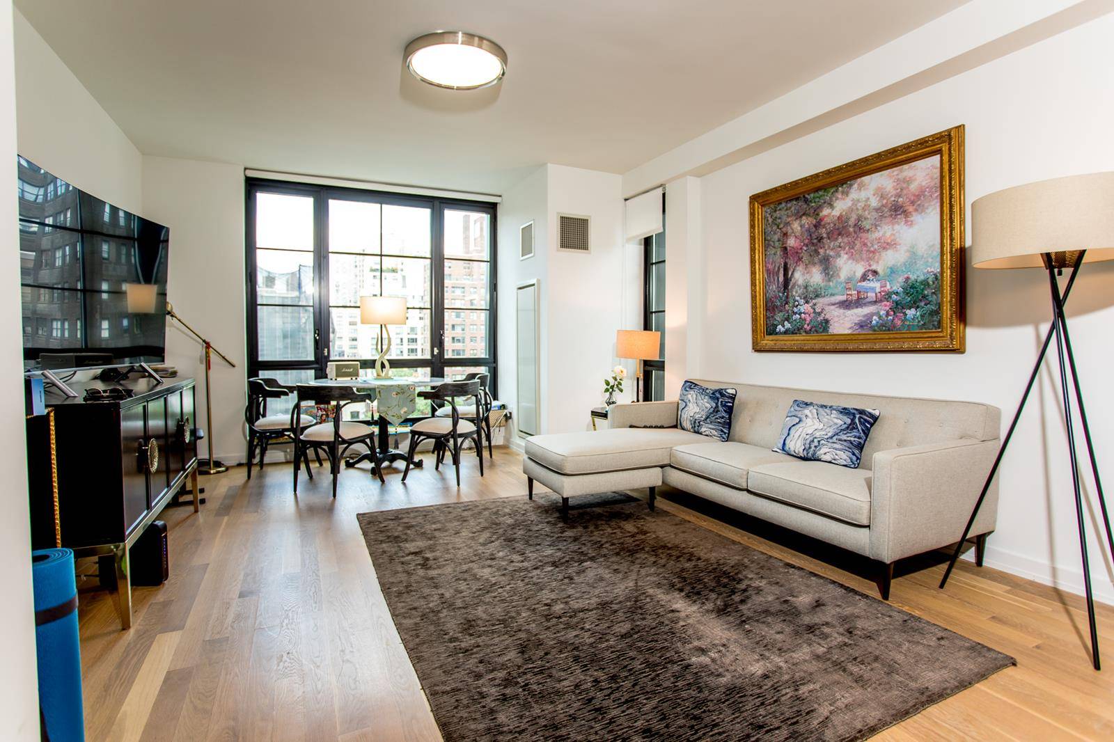 Apartment 9B is a beautiful two bedroom, two bathroom apartment with panoramic floor to ceiling, industrial style, square casement windows framing iconic, sweeping Manhattan views.