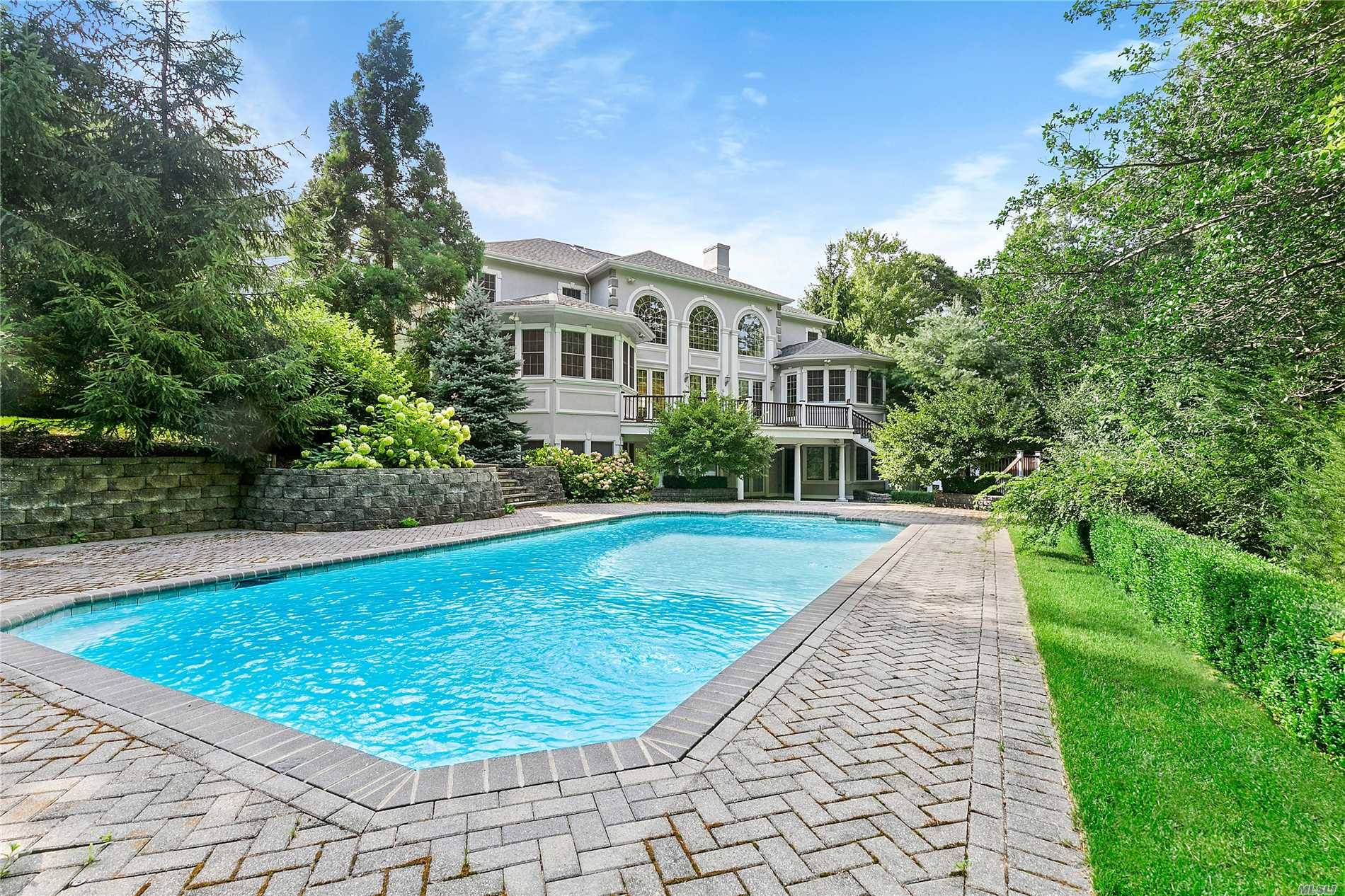 This Beautifully Maintained 5,800 +/- Square Foot Villa Is Located In Amagansett And Rests On Over 1.