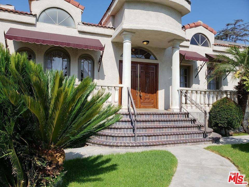 Spanish style home located on a beautiful tree lined street in Windsor Village