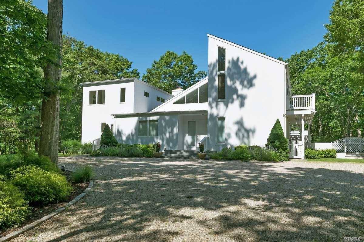 Soaring Modern On Almost An Acre Located In Prestigious North Hollow Beach Community In East Hampton!