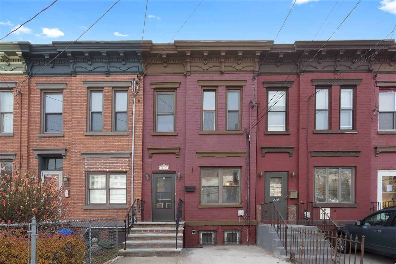 Tastefully renovated single family brick row house only a few blocks walk to Journal Square Path