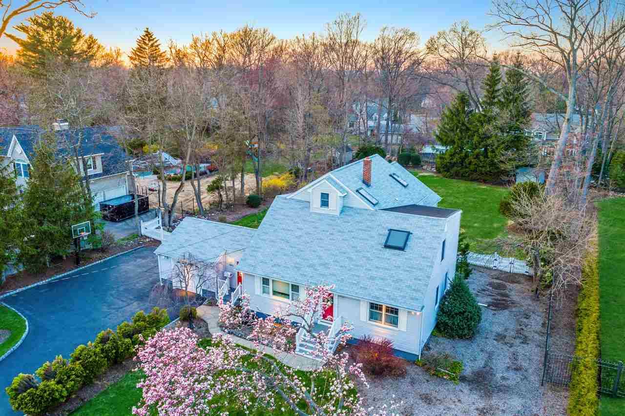 Pride of ownership is evident in this extended large Cape Colonial home on over a half acre of flat property in desirable Wyckoff