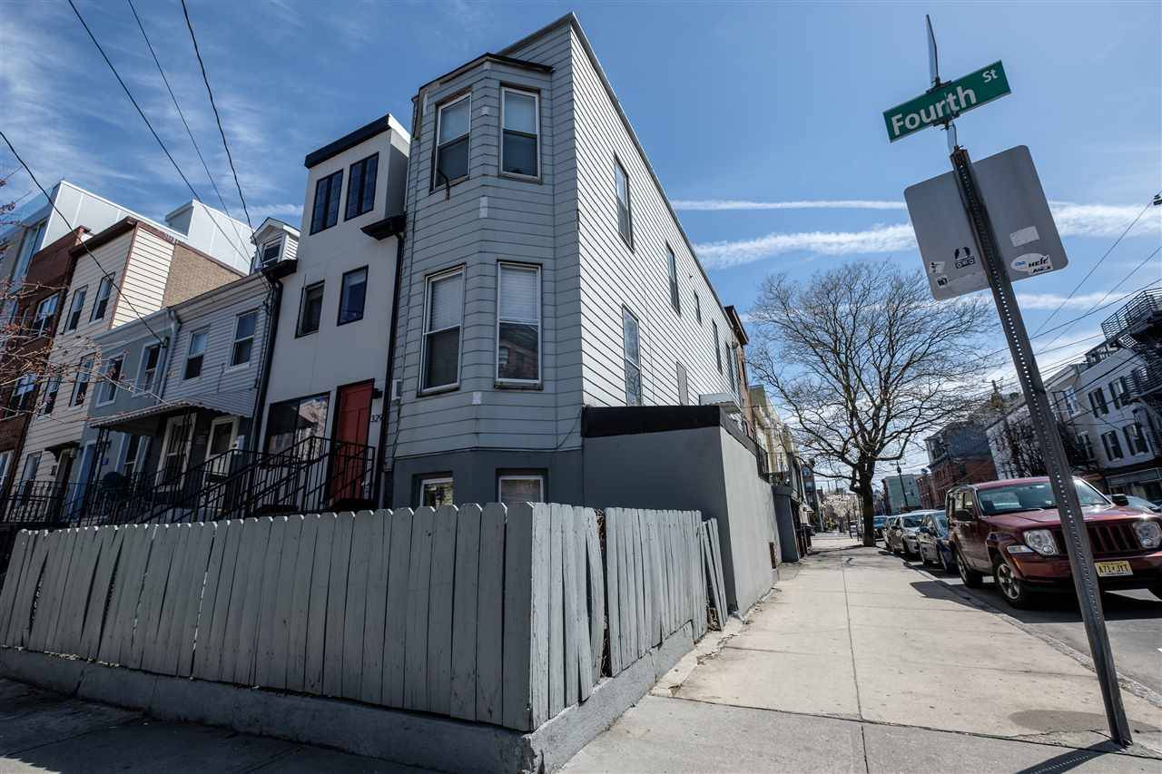 A wonderful opportunity to own a charming bright row house with high ceilings and character on a tree lined Downtown Jersey City street