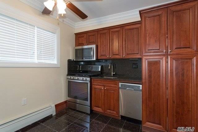 Tuscany Kitchen With Stainless Steel Appliances.