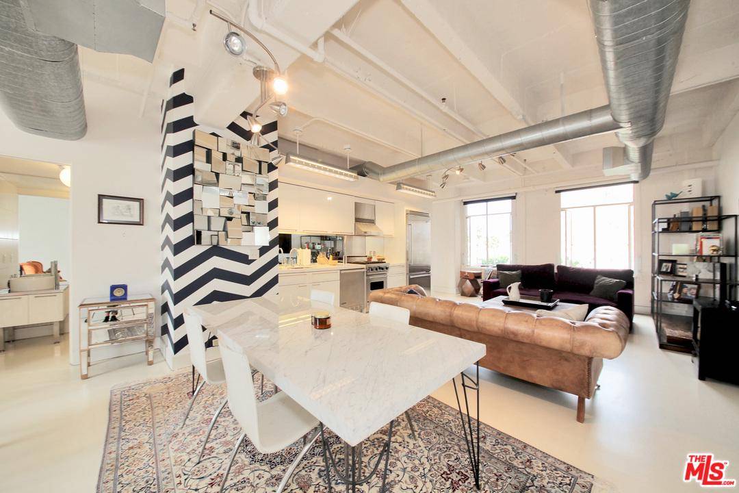 One of a kind 2 story loft living at its best in the heart of Hollywood at the corner of Hollywood and Vine